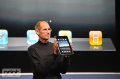 Steve Jobs holding iPad
